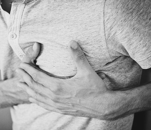 Man clutching his heart